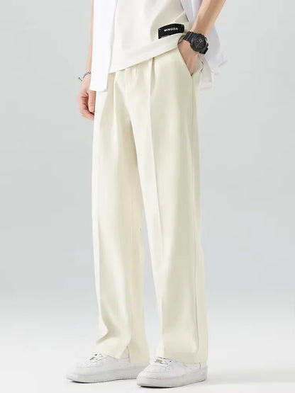 PANTALONI A GAMBA DRITTA CON DRAPPEGGIO AMPIO